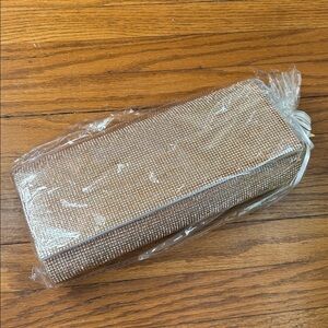 Rose gold sequined clutch